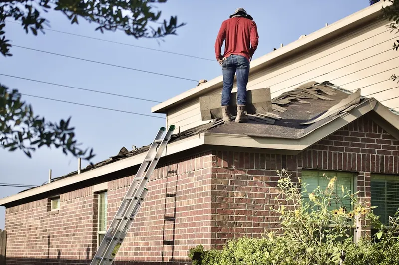 Professional roofer working on a residential roof in Five Forks